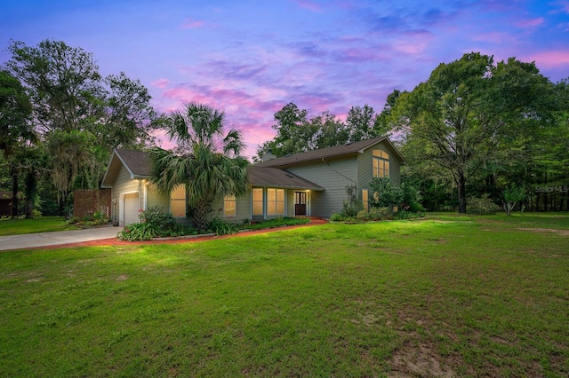 7201 SW 97th Ln, Gainesville, FL 32608 - view of front of house featuring driveway, a front yard, and an attached garage