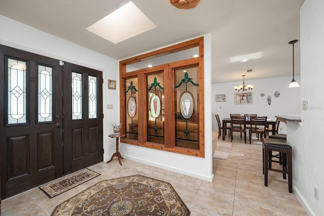 7201 SW 97th Ln, Gainesville, FL 32608 - entryway with light tile patterned floors and a chandelier