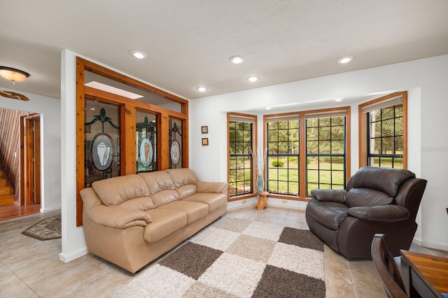 7201 SW 97th Ln, Gainesville, FL 32608 - living area featuring recessed lighting, light tile patterned floors, and stairs