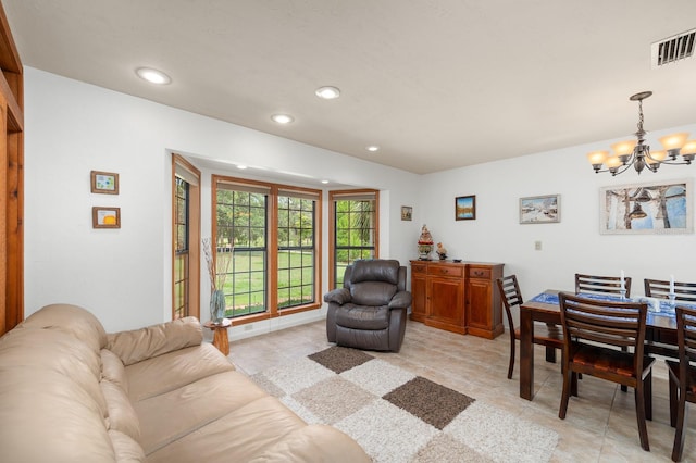 7201 SW 97th Ln, Gainesville, FL 32608 - living room with a chandelier, recessed lighting, and light tile patterned floors
