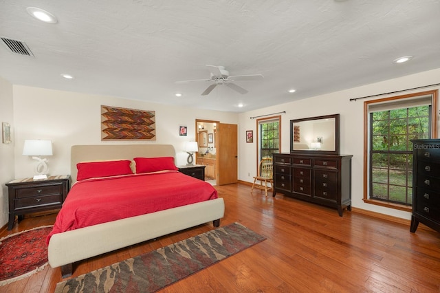 7201 SW 97th Ln, Gainesville, FL 32608 - bedroom with wood finished floors, recessed lighting, a ceiling fan, and ensuite bathroom