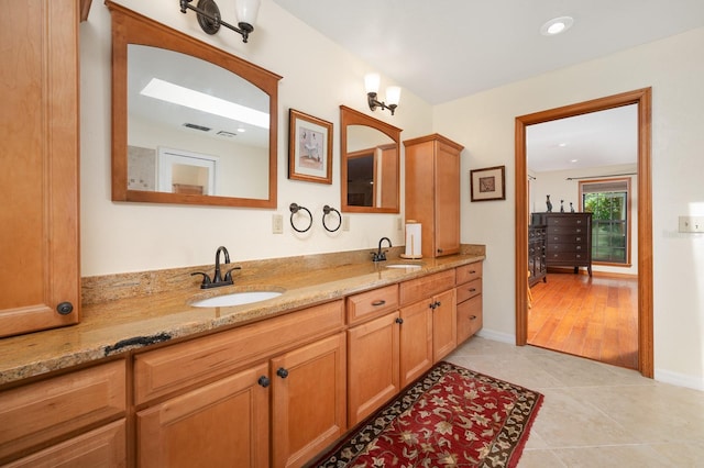 7201 SW 97th Ln, Gainesville, FL 32608 - bathroom featuring double vanity, tile patterned floors, and recessed lighting
