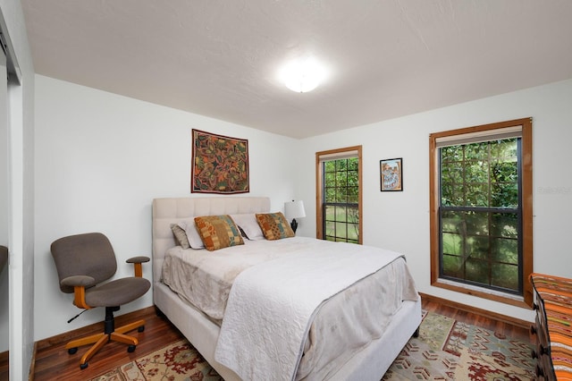 7201 SW 97th Ln, Gainesville, FL 32608 - bedroom featuring wood finished floors and baseboards