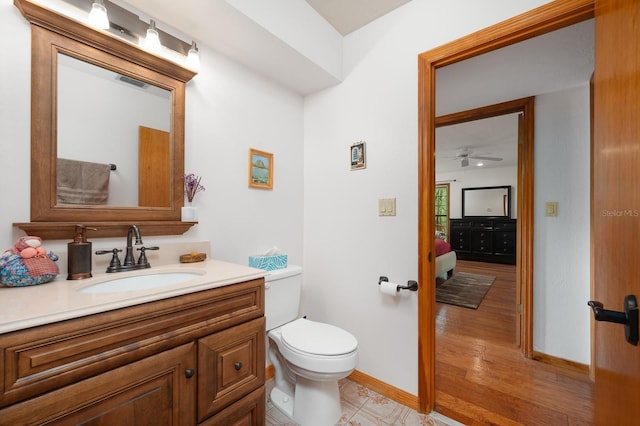 7201 SW 97th Ln, Gainesville, FL 32608 - half bath with vanity, wood finished floors, and ceiling fan