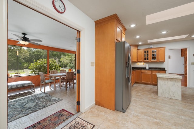 7201 SW 97th Ln, Gainesville, FL 32608 - kitchen featuring stainless steel refrigerator with ice dispenser, recessed lighting, glass insert cabinets, brown cabinets, and a ceiling fan