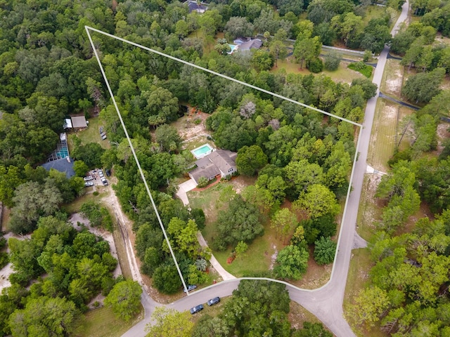 7201 SW 97th Ln, Gainesville, FL 32608 - aerial overview of property's location with property boundaries highlighted and a heavily wooded area