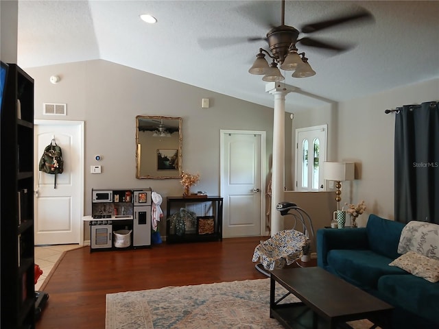 309 N Westwood St, Bushnell, FL 33513 - living room featuring lofted ceiling, ceiling fan, wood finished floors, a textured ceiling, and decorative columns