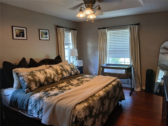 309 N Westwood St, Bushnell, FL 33513 - bedroom with wood finished floors and a ceiling fan