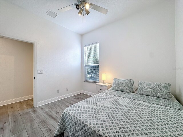 2421 Cimmaron Ash Way, Apopka, FL 32703 - bedroom with wood finished floors and ceiling fan