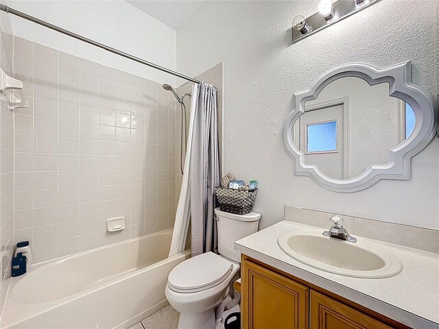 2421 Cimmaron Ash Way, Apopka, FL 32703 - bathroom featuring vanity, shower / bath combination with curtain, a textured wall, and tile patterned flooring