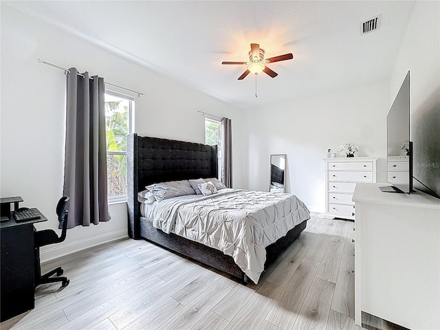 2421 Cimmaron Ash Way, Apopka, FL 32703 - bedroom with light wood-style floors and ceiling fan