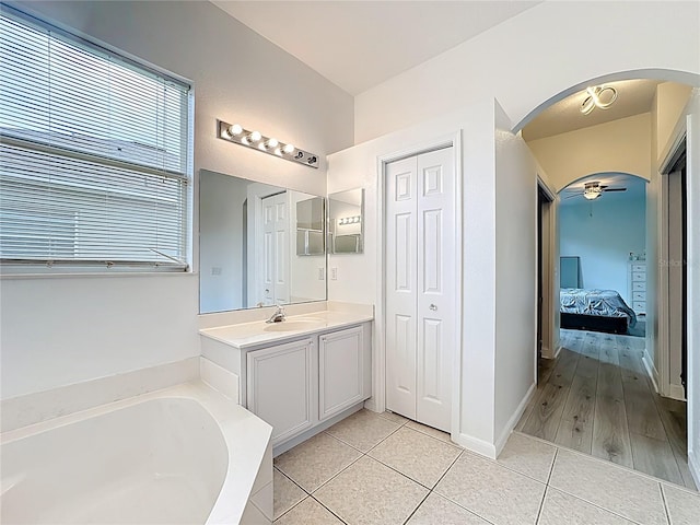 2421 Cimmaron Ash Way, Apopka, FL 32703 - ensuite bathroom with a garden tub, vanity, tile patterned floors, and a closet