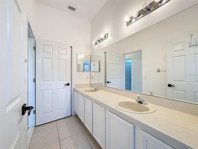 2421 Cimmaron Ash Way, Apopka, FL 32703 - full bathroom with double vanity and tile patterned flooring