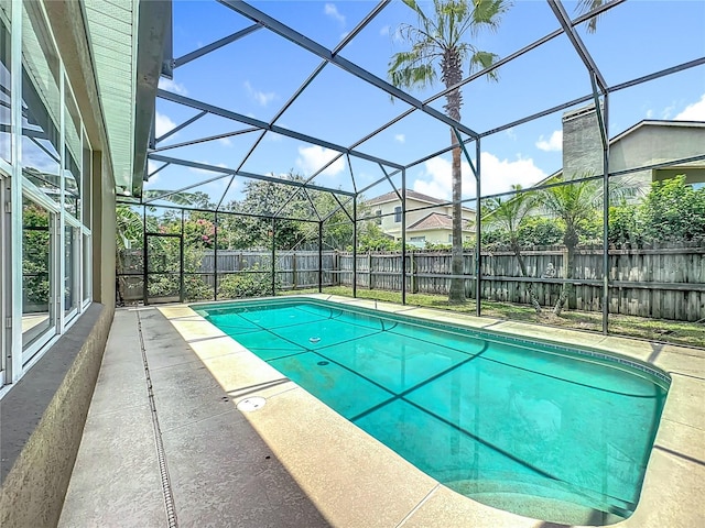 2421 Cimmaron Ash Way, Apopka, FL 32703 - view of swimming pool featuring a fenced backyard, glass enclosure, and a patio