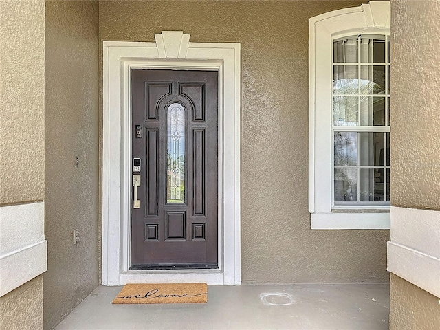 2421 Cimmaron Ash Way, Apopka, FL 32703 - property entrance featuring stucco siding