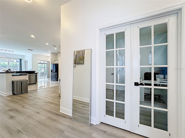 2421 Cimmaron Ash Way, Apopka, FL 32703 - entryway with light wood-style flooring and recessed lighting
