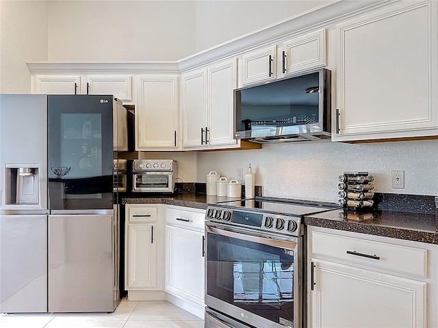 2421 Cimmaron Ash Way, Apopka, FL 32703 - kitchen featuring appliances with stainless steel finishes, white cabinets, and dark countertops