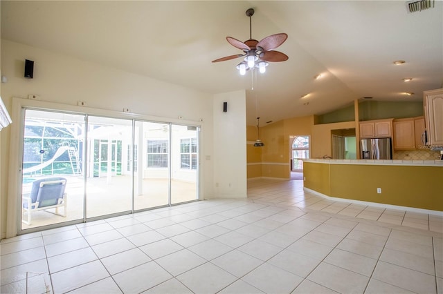 14933 Thoroughbred Ln, Montverde, FL 34756 - unfurnished living room with ceiling fan, vaulted ceiling, and light tile patterned flooring