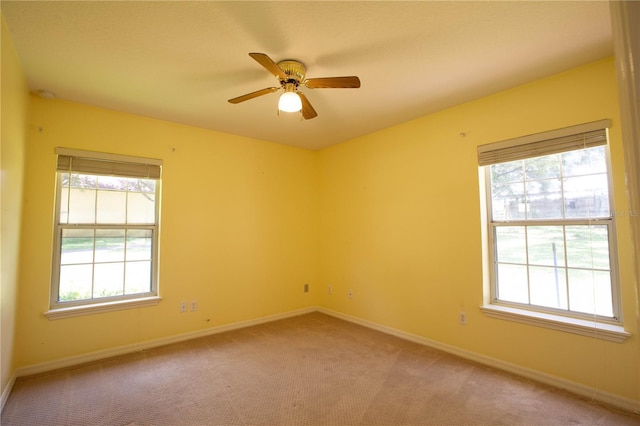 14933 Thoroughbred Ln, Montverde, FL 34756 - empty room with light carpet, plenty of natural light, and a ceiling fan