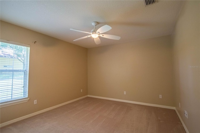 14933 Thoroughbred Ln, Montverde, FL 34756 - unfurnished room with light colored carpet, a ceiling fan, and a textured ceiling