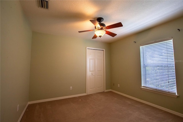 14933 Thoroughbred Ln, Montverde, FL 34756 - carpeted spare room featuring a ceiling fan and baseboards