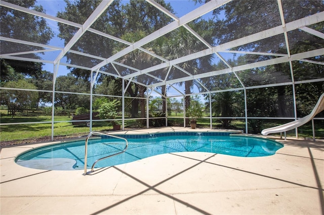 14933 Thoroughbred Ln, Montverde, FL 34756 - outdoor pool with a patio area, a water slide, a lanai, and view of wooded area