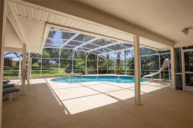 14933 Thoroughbred Ln, Montverde, FL 34756 - outdoor pool with a patio, a water slide, and a lanai