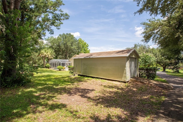 14933 Thoroughbred Ln, Montverde, FL 34756 - view of green lawn featuring a shed and glass enclosure