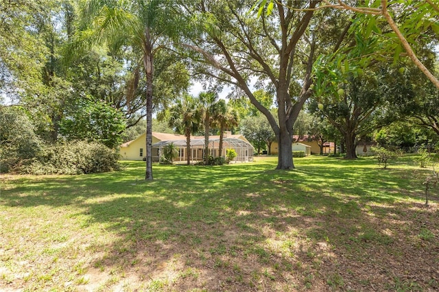 14933 Thoroughbred Ln, Montverde, FL 34756 - view of green lawn with a lanai