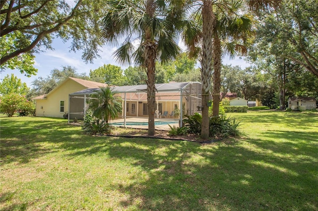 14933 Thoroughbred Ln, Montverde, FL 34756 - rear view of house featuring a yard, an outdoor pool, and a lanai