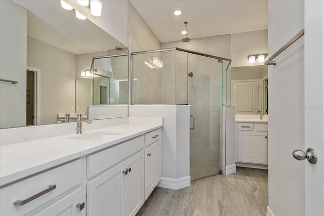 111 Bottle Brush Dr, Haines City, FL 33844 - bathroom featuring vanity, a stall shower, wood finished floors, and recessed lighting