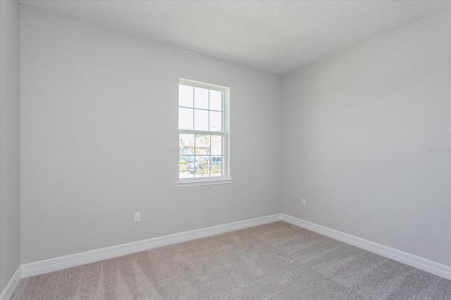 111 Bottle Brush Dr, Haines City, FL 33844 - empty room with carpet floors and baseboards