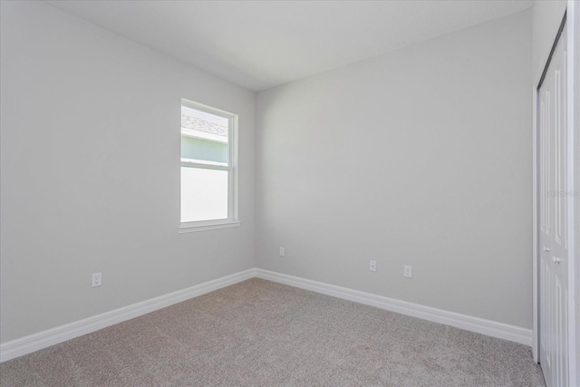 111 Bottle Brush Dr, Haines City, FL 33844 - spare room featuring carpet floors and baseboards