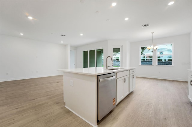 991 Fiesta Key Cir, Lady Lake, FL 32159 - kitchen featuring dishwasher, a center island with sink, light wood-style flooring, white cabinets, and recessed lighting