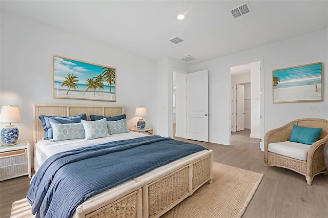991 Fiesta Key Cir, Lady Lake, FL 32159 - bedroom featuring wood finished floors and baseboards