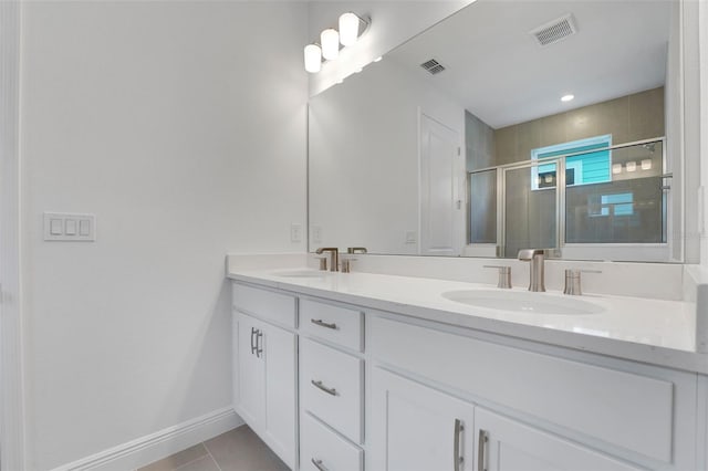991 Fiesta Key Cir, Lady Lake, FL 32159 - full bath with double vanity, a stall shower, and tile patterned floors