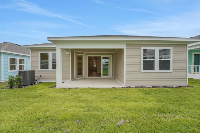 991 Fiesta Key Cir, Lady Lake, FL 32159 - back of house with a patio and a yard