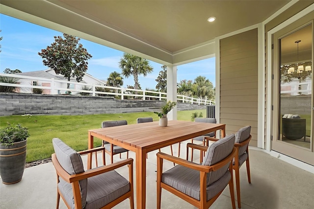 991 Fiesta Key Cir, Lady Lake, FL 32159 - fenced backyard with outdoor dining area and a patio