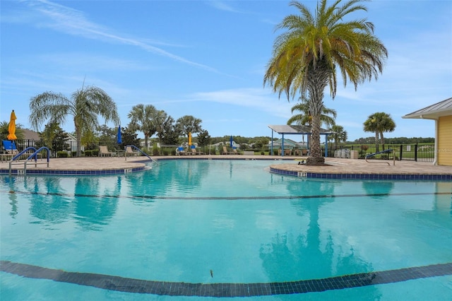 991 Fiesta Key Cir, Lady Lake, FL 32159 - community pool with a patio area