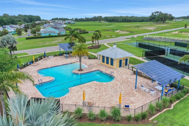 991 Fiesta Key Cir, Lady Lake, FL 32159 - community pool with view of scattered trees