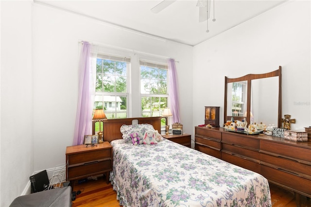 709 Daphne Ave, Umatilla, FL 32784 - bedroom with wood finished floors and a ceiling fan