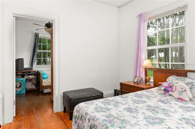709 Daphne Ave, Umatilla, FL 32784 - bedroom featuring wood finished floors and ornamental molding