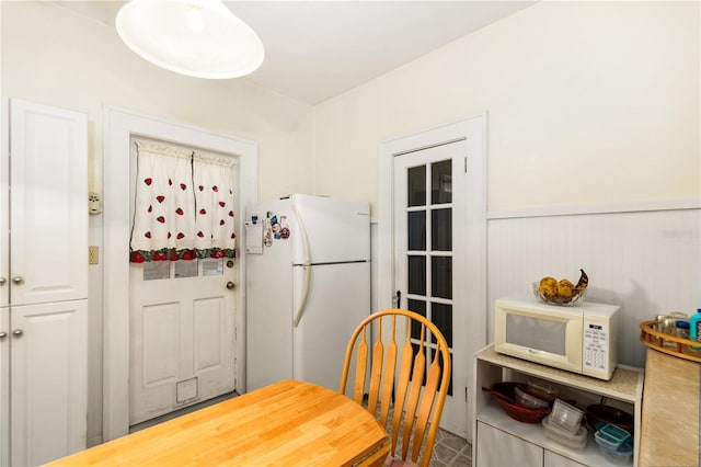 709 Daphne Ave, Umatilla, FL 32784 - dining room featuring wainscoting