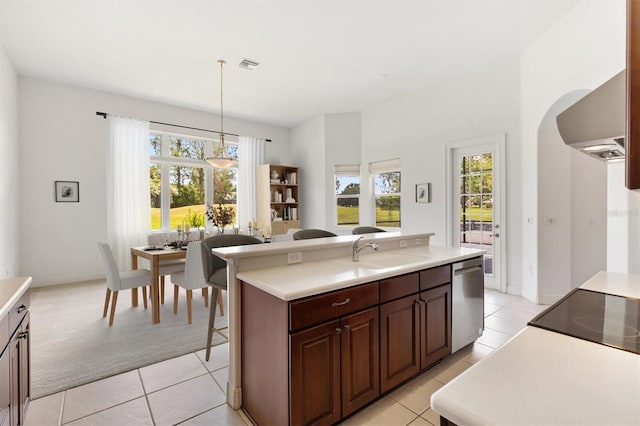 6109 Spinnaker Loop, Lady Lake, FL 32159 - kitchen featuring healthy amount of natural light, ventilation hood, and light countertops