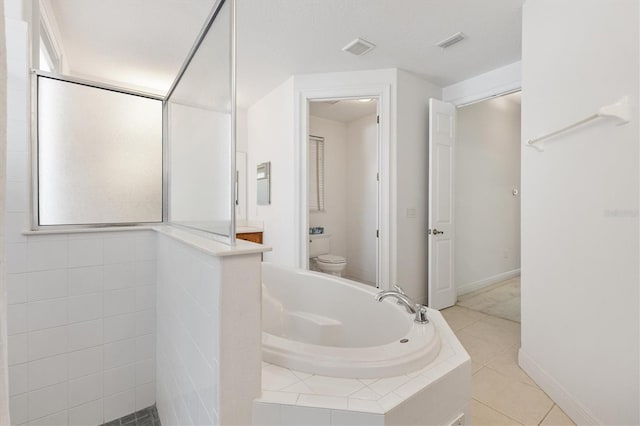 6109 Spinnaker Loop, Lady Lake, FL 32159 - full bath featuring a garden tub, tile patterned floors, and tiled shower