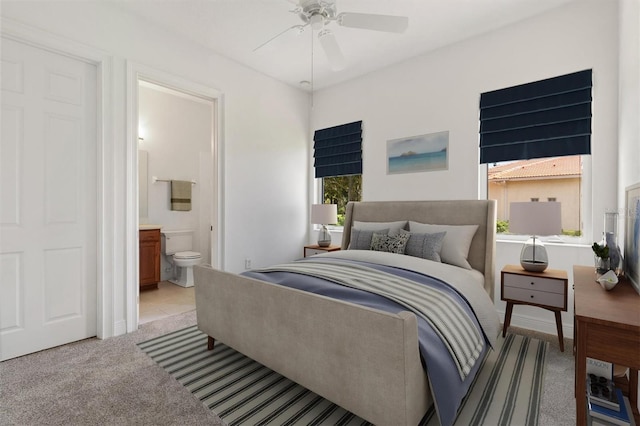 6109 Spinnaker Loop, Lady Lake, FL 32159 - bedroom with light colored carpet, ensuite bathroom, and a ceiling fan