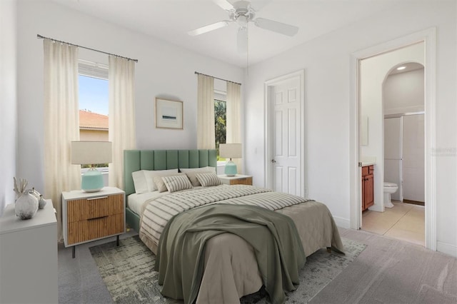 6109 Spinnaker Loop, Lady Lake, FL 32159 - bedroom featuring multiple windows, arched walkways, connected bathroom, and ceiling fan