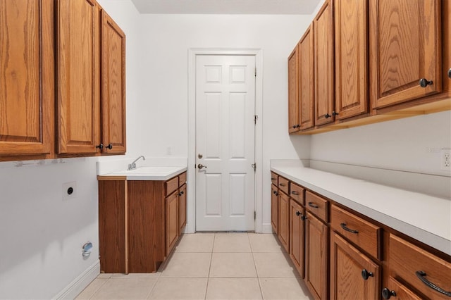 6109 Spinnaker Loop, Lady Lake, FL 32159 - laundry area with cabinet space, light tile patterned floors, and hookup for an electric dryer