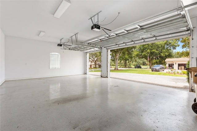 6109 Spinnaker Loop, Lady Lake, FL 32159 - garage with a garage door opener