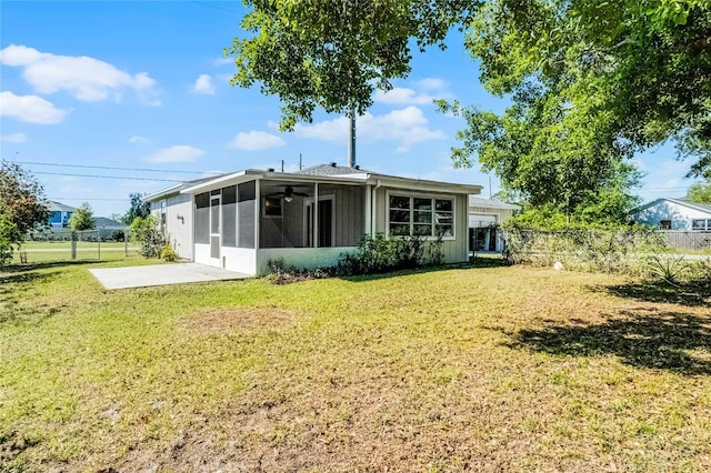 4751 Deer Run Rd, Saint Cloud, FL 34772 - rear view of house featuring a sunroom, ceiling fan, and a patio area